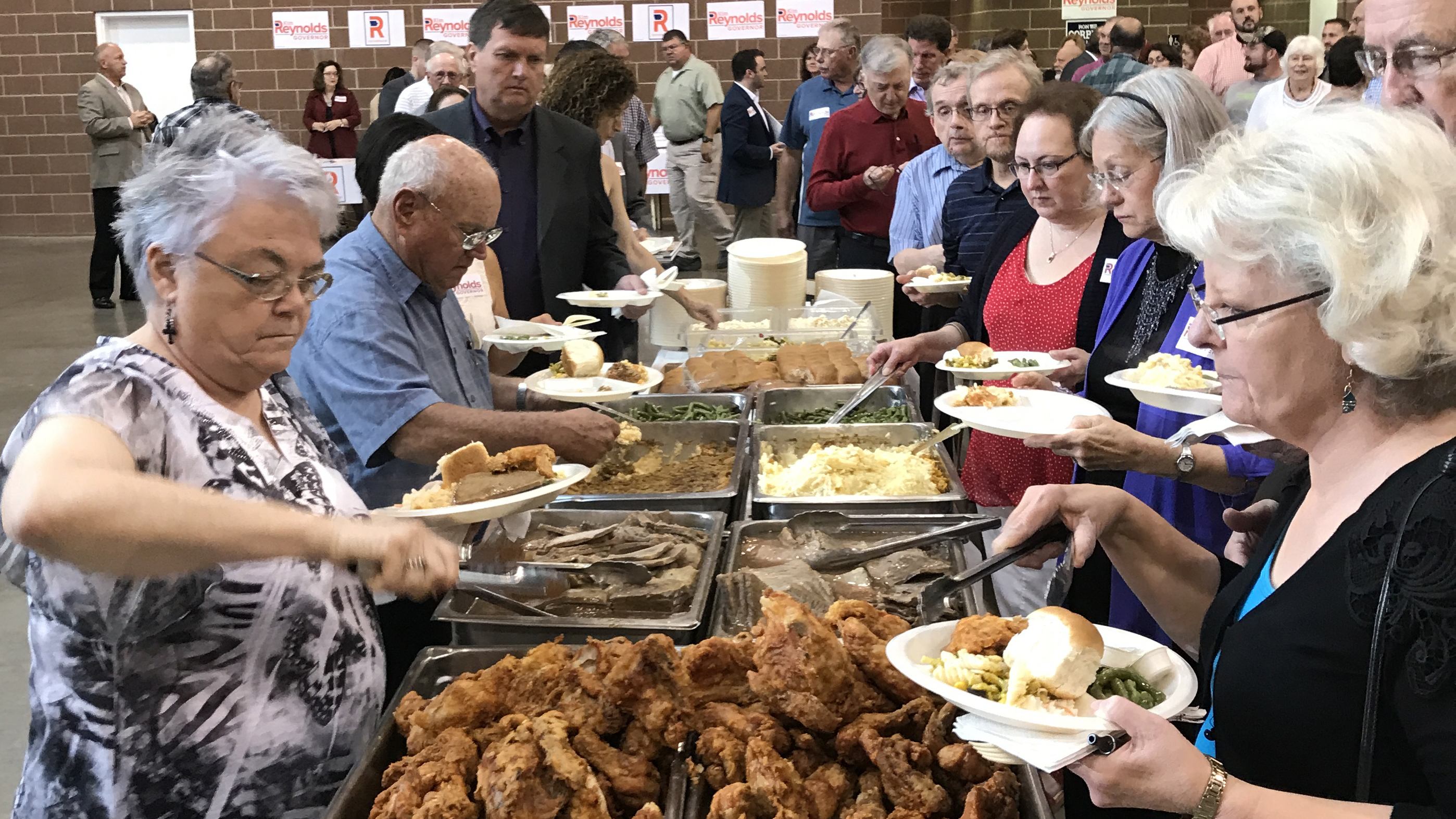 Social conservatives enjoying a fried chicken dinner in Des Moines on Saturday night. (Photo by Clay Masters/Iowa Public Radio)