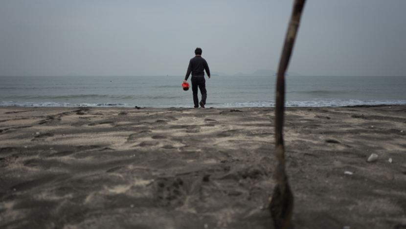 Dr. Lincoln Fok, a teacher and researcher at the Education University in Hong Kong, is pictured here. He studies microplastic pollution in Hong Kong and the South China Sea.