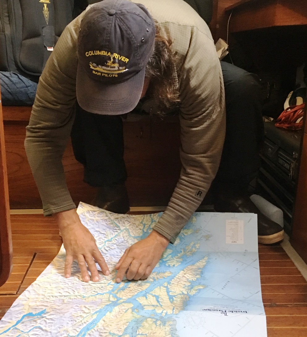 On board the Sea Bear, Seth Meyer shows the route through Alaska’s Inside Passage. (Photo by Leila Kheiry/KRBD)
