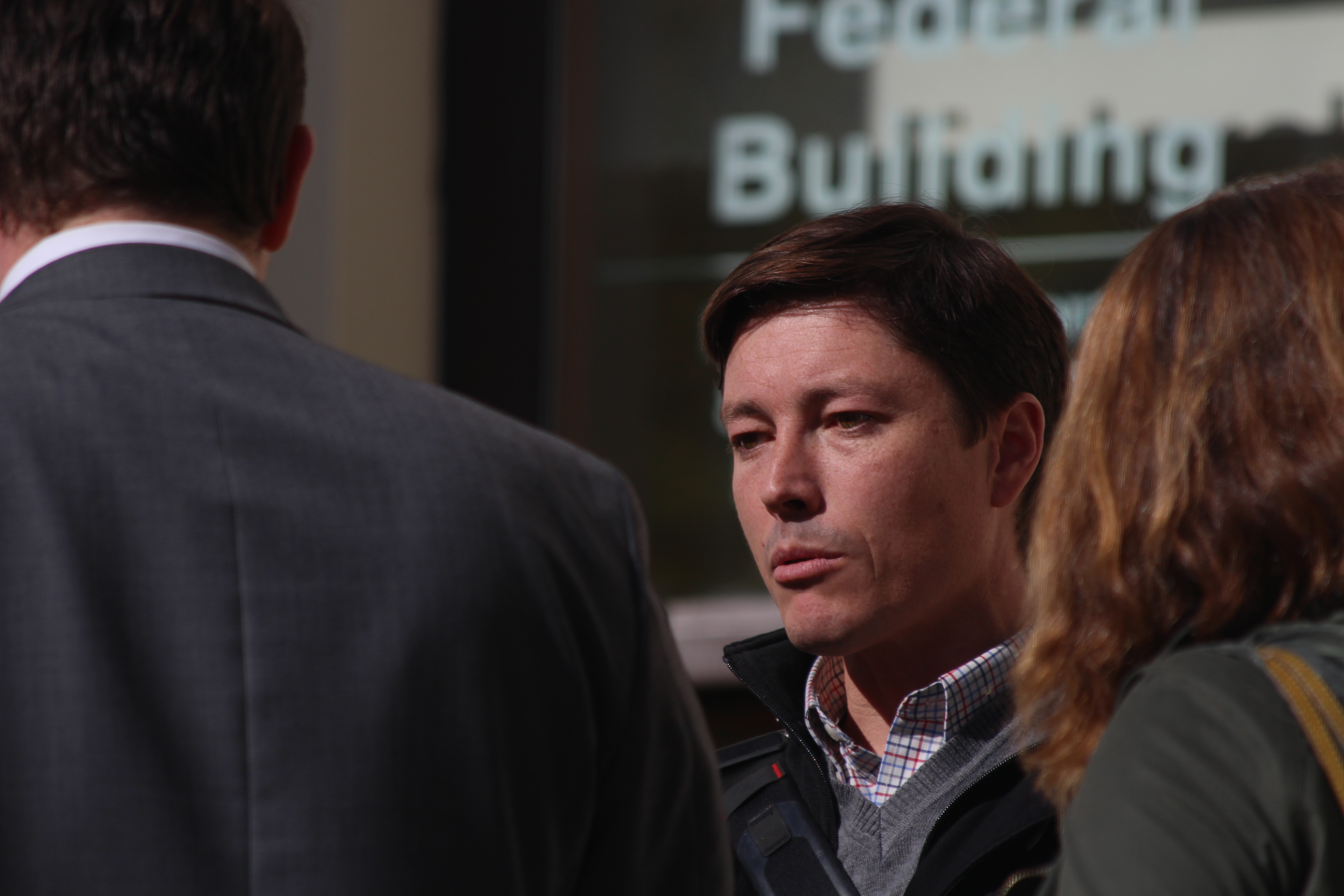 Ryan Binkley speaks with reporters following the court hearing on the sale of the Alaska Dispatch News (Photo By Wesley Early/Alaska Public Media)