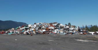 Scrap metal and junk cars are piled up at Petersburg’s landfill this month. (Photo by Joe Viechnicki/KFSK)