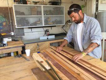 Wesley Nicoll builds a planter as part of the vocational education program at Wildwood Correctional Center in July 2017. (Photo by Anne Hillman/Alaska Public Media)