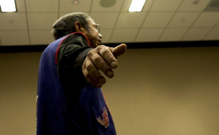 Tlingit storyteller Bob Sam spreads his arms mimicking the flight of a bird while he tells a story Tuesday, Oct. 17, 2017, during a Elders and Youth Conference workshop in Anchorage. (Photo by Tripp J Crouse)