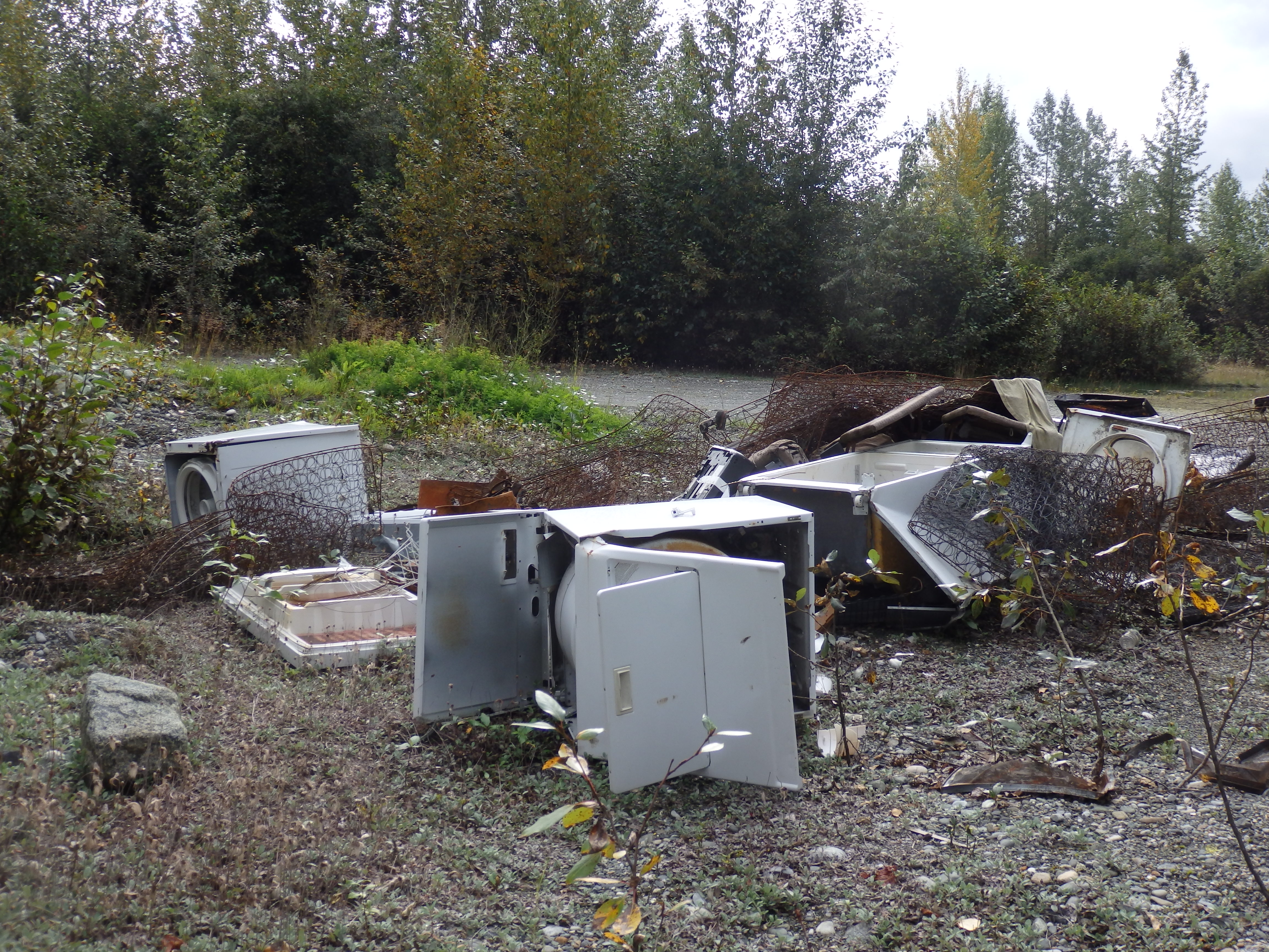At an informal, and illegal, dump 25 miles out the Haines Highway, residents have tossed everything from old washing machines to broken chest freezers. (Photo by Abbey Collins/KHNS)