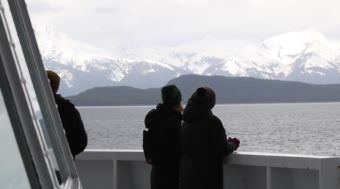 Passengers watch the scenery go by on the ferry Matanuska's forward deck during a May 3, 2017, sailing from Juneau to Haines. (Photo by Aaron Bolton/KSTK)