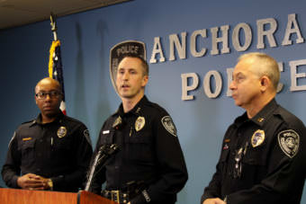 Anchorage police Capt. Ken McCoy, left, listens as Police Chief Justin Doll speaks about the Anchorage Police Department’s new crime suppression strategy at departmetn headquarters next to Lt. Kevin Vandegriff. (Photo by Zachariah Hughes/Alaska Public Media)