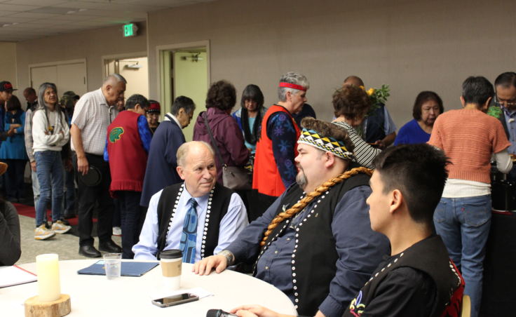 Gov. Bill Walker talks with Central Council President Richard Peterson at the Indigenous Peoples Day celebration Oct. 9, 2017, at Elizabeth Peratrovich Hall. (Photo by Adelyn Baxter/KTOO)