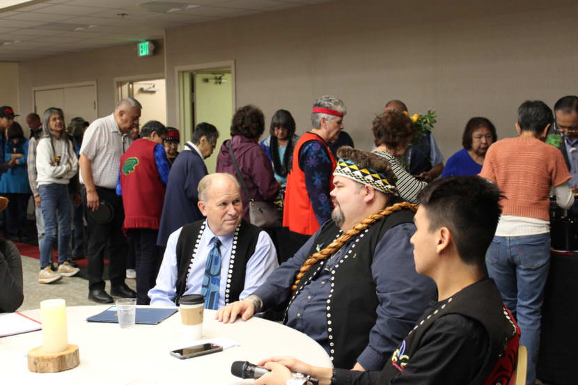 Gov. Bill Walker talks with Central Council President Richard Peterson at the Indigenous Peoples Day celebration Oct. 9, 2017, at Elizabeth Peratrovich Hall. (Photo by Adelyn Baxter/KTOO)