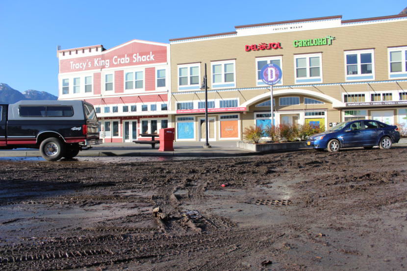 Mud sits in the parking lot at Warners Wharf on Oct. 28, the day after heavy rains flooded part of the lot. (Photo by Adelyn Baxter/KTOO)