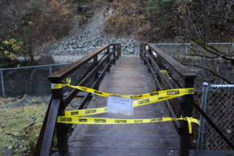 Caution tape blocks off the entrance to the Flume Trail off Basin Road on Oct. 29, 2017. (Photo by Adelyn Baxter/KTOO)