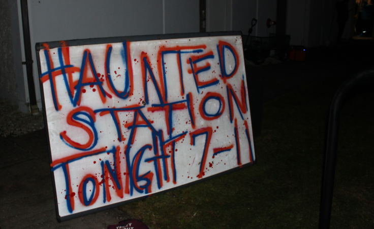 A sign advertises the U.S. Coast Guard Haunted House on Oct. 28, 2017. (Photo by Adelyn Baxter/KTOO)