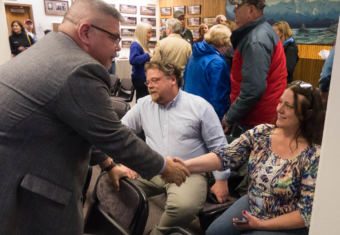 Juneau Assembly challenger Rob Edwardson and incumbent Debbie White shake hands after unofficial election results come in on Oct. 3, 2017. Edwardson won.