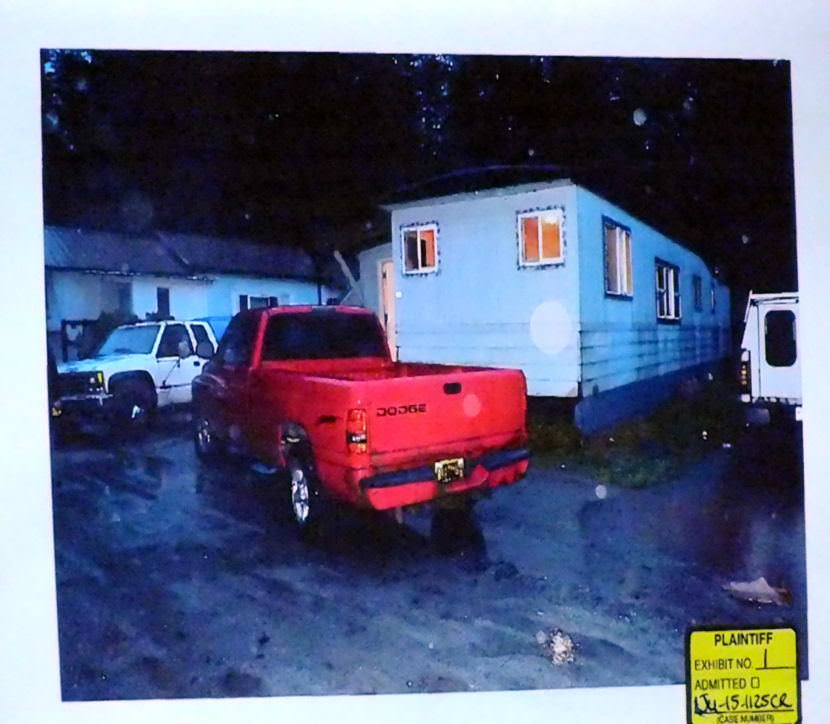 Photo of the mobile home at C-16 Kodzoff Acres Trailer Park is presented as evidence during the Christopher Strawn trial on Oct. 6, 2017. (Photo by Matt Miller/KTOO)