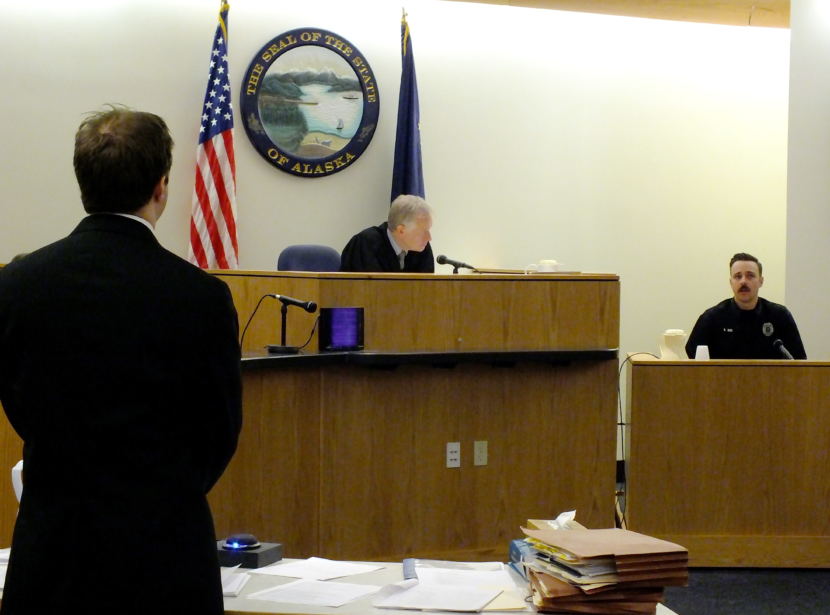 Christopher Strawn (far left) questions Juneau Police Detective Benjamin Beck as Superior Court Judge Philip Pallenberg listens during the homicide trial on Oct. 9, 2017. (Photo by Matt Miller/KTOO)