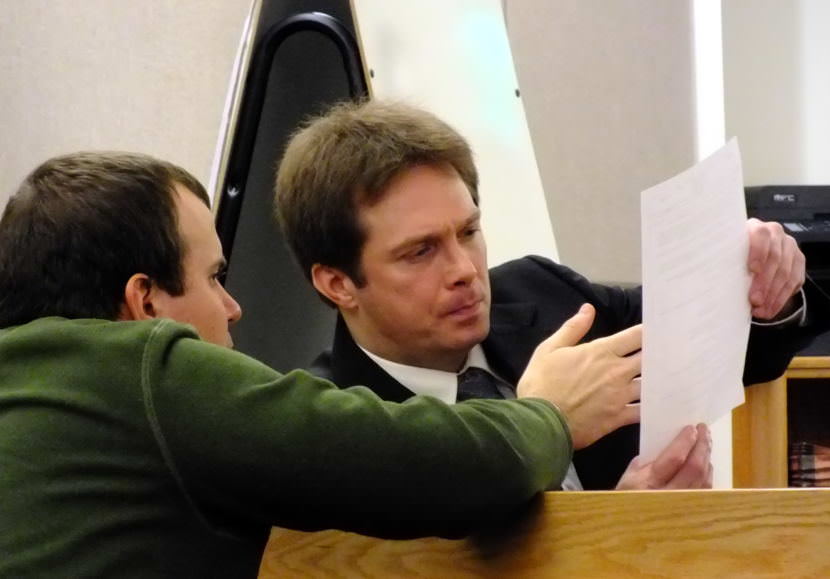 Stand-by counsel Nicholas Polasky (left) confers with Christopher Strawn during his homicide trial on Oct. 16, 2017.