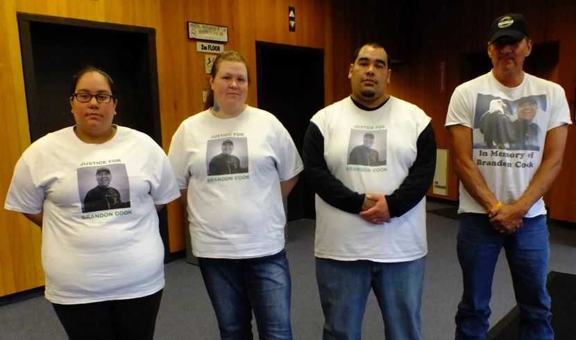 Friends and family of Brandon Cook wear a T-shirts supporting him on Wednesday, Oct. 18, 2017, at the Dimond Courthouse in Juneau. From left to right, Brittany Johnson, Tiffany Johnson, and Brandon Johnson's T-shirts read "Justice for Brandon Cook" on the front and 'Gone but not forgotten' on the back.. Cook's father Don Cook. is on the right. 
