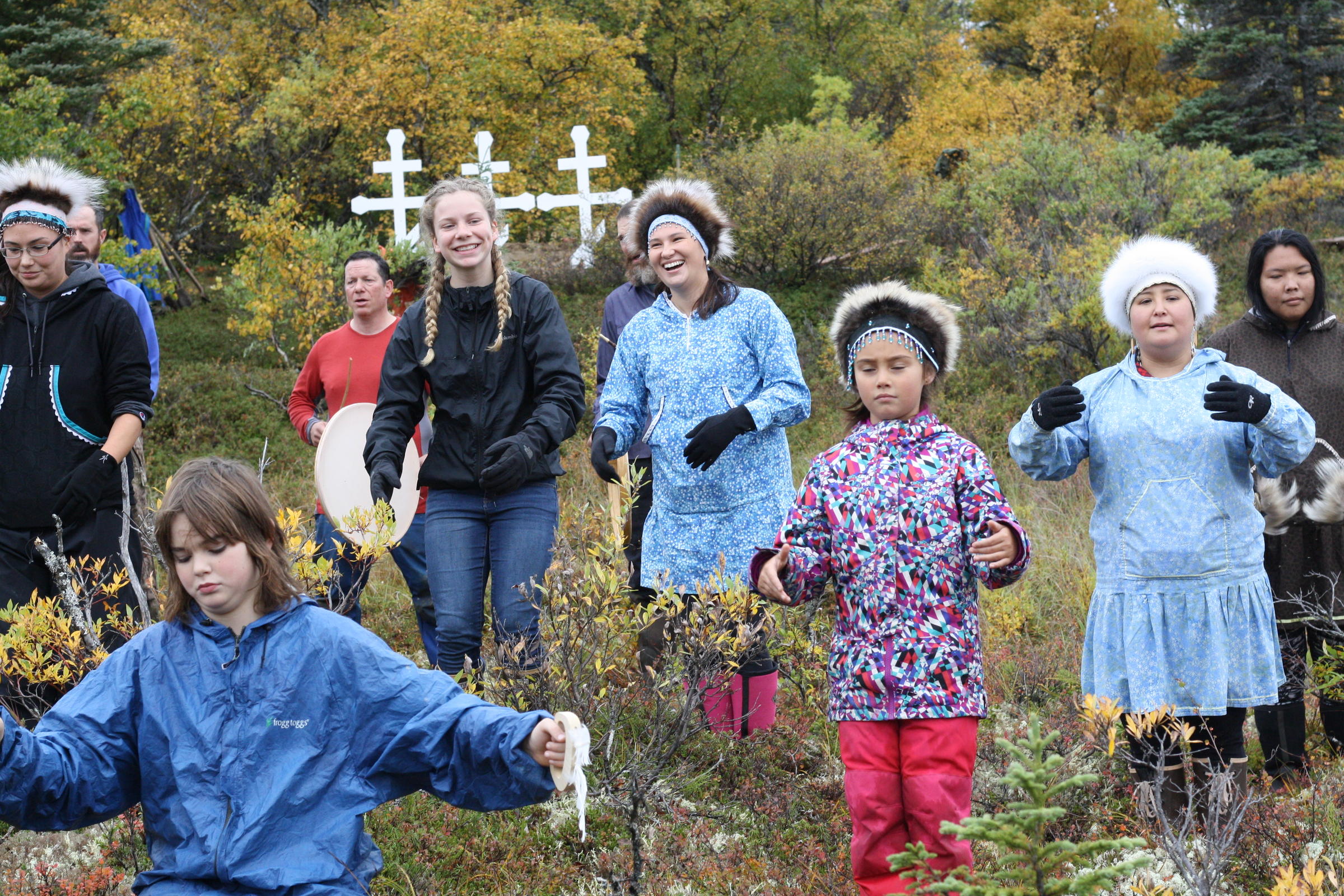 Celebrating the repatriation of remains at a cemetery near Igiugig in September. (Photo by KDLG)