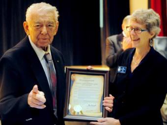 Herb Didrickson accepts a proclamation from Sitka Mayor Mim McConnell at banquet honoring his induction into the Alaska Sports Hall of Fame in 2012. The gymnasium at the Hames Center is named for Didrickson. (Photo courtesy Dan Evans)