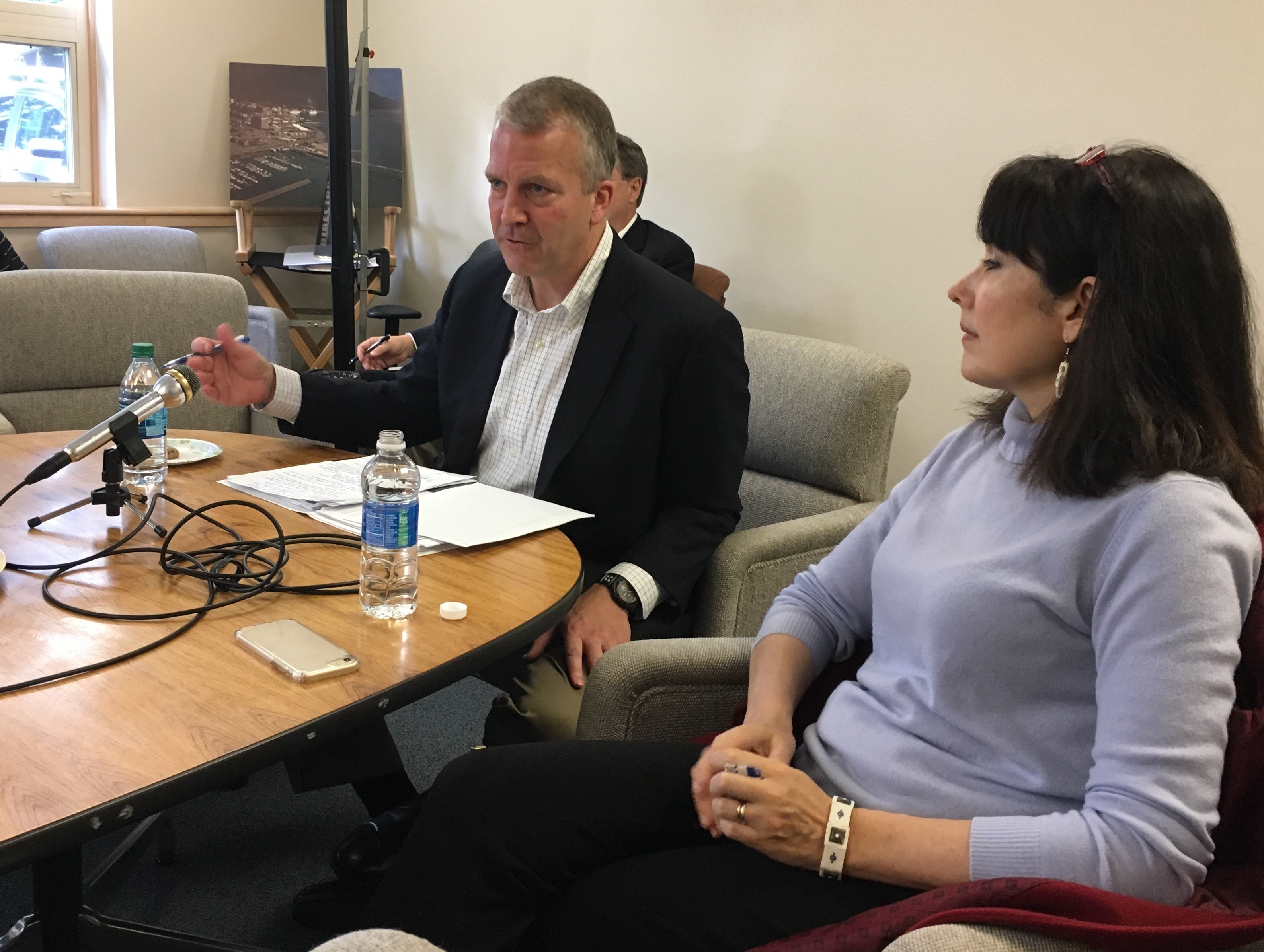 U.S. Sen. Dan Sullivan, a Republican, speaks with business leaders in a meeting at the Juneau Chamber of Commerce on Monday. His wife Julie is on the right. (Photo by Andrew Kitchenman/KTOO)