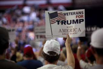 A man holds a sign supporting Donald Trump at a rally at Veterans Memorial Coliseum at the Arizona State Fairgrounds in Phoenix, Arizona, in June 2016.