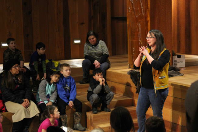 Culture Bearer Daaljíni Cruise tells Juneau second graders a traditional Alaskan Native story during an excursion to the Walter Sobeloff Building on Nov. 16, 2017. (Photo by Adelyn Baxter/KTOO)