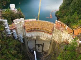 The Blue Lake dam under construction in September 2014. Half of all electric bills in Sitka now pay down the debt to build it. On the upside: Sitka has 40 percent excess capacity, and can afford to attract major industry. (Photo courtesy Desiree Brandis)