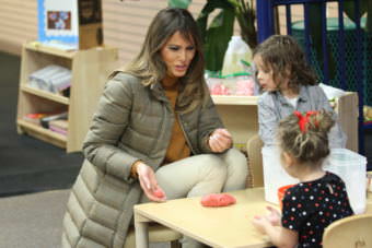 First Lady Melania Trump rolls a ball of Play-Doh to one of the military children at Joint Base Elmendorf-Richardson in Anchorage. (Photo by Wesley Early/Alaska Public Media)