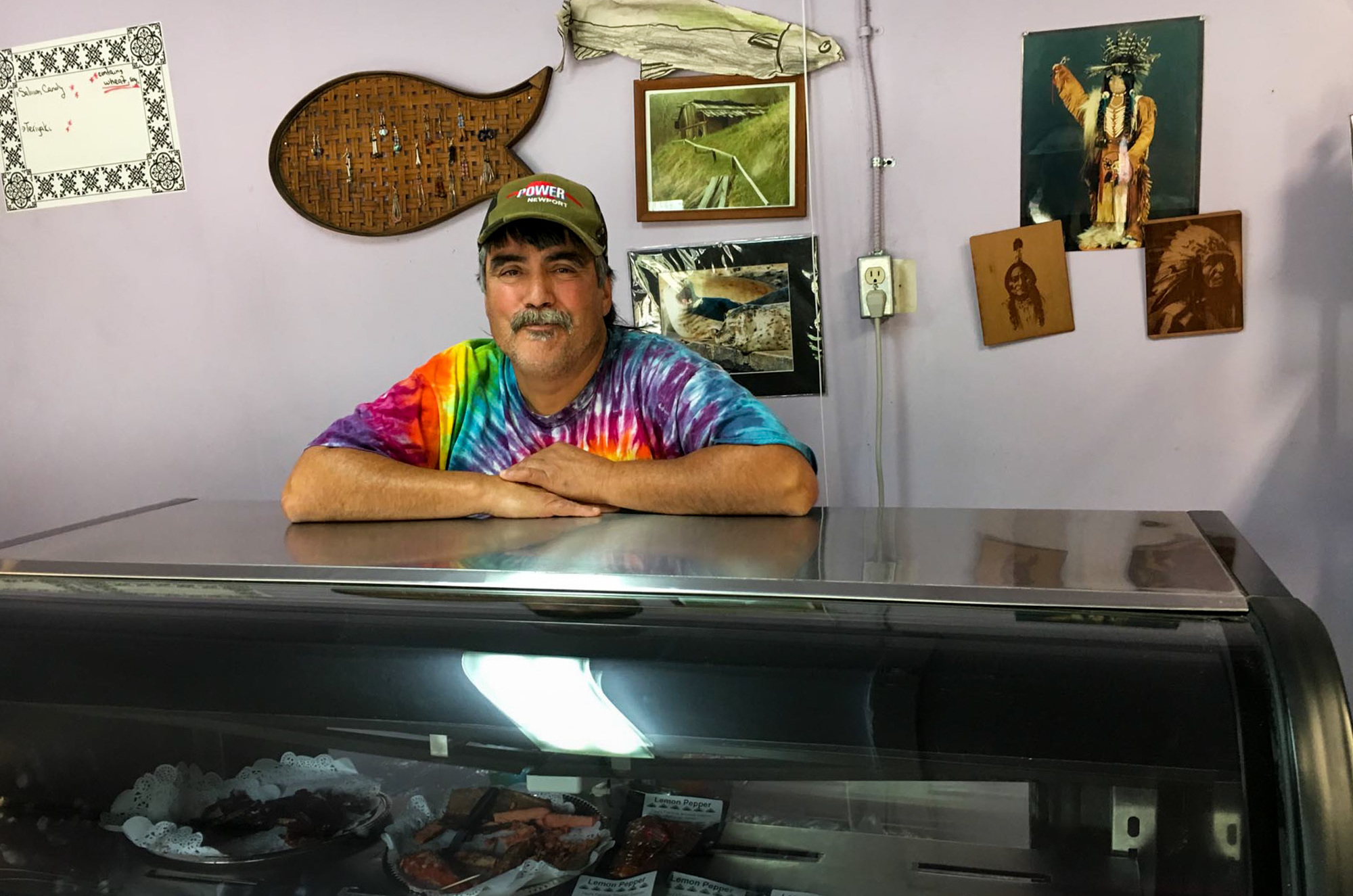 Paul Mattz Van Mechelen, who runs Paul's Famous Smoked Salmon, has had to buy salmon from fishermen hundreds of miles away instead of fishing for Chinook in the Klamath River, just 50 feet from his California shop. (Photo by Lisa Morehouse/KQED)