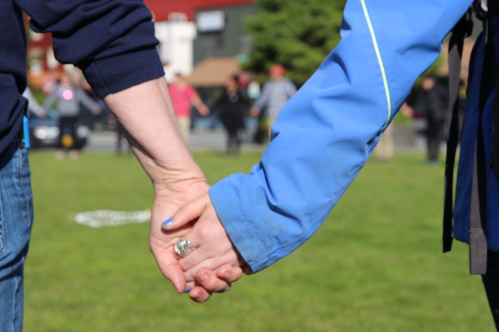 Nearly 100 Sitkans held hands in Totem Square last year in memory of the Orlando shooting victims. (Photo by Katherine Rose/KCAW)