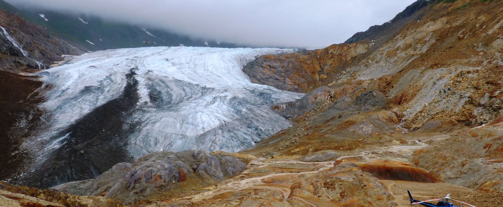 Oxidized rock colors a valley where one of Seabridge Gold's KSM Project's open pit mines will be dug. Canadian officials have opened their final comment period before environmental approval. (Photo by Ed Schoenfeld/CoastAlaska)