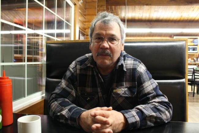 Mike Douville in a diner in Craig. Douville serves on the regional advisory council that makes recs to federal subsistence board. (Photo by Elizabeth Jenkins/Alaska's Energy Desk) 12/18/17
