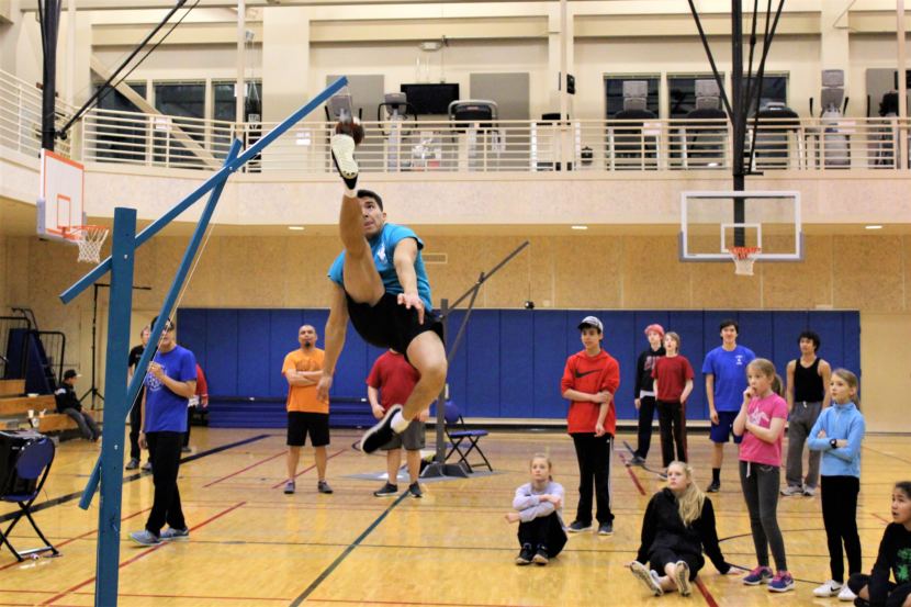 Kyle Worl demonstrates the One Foot High Kick, and event in the Native Youth Olympics. (Photo by Adelyn Baxter/KTOO)