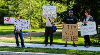 Protesters demonstrate in favor of net neutrality near the home of Federal Communications Commission Chairman Ajit Pai in May 2017. Some Alaska officials are looking at what they can do to restore the Obama-era policy.