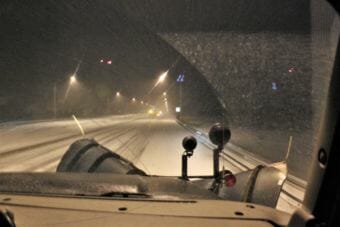 A view from the front seat of a DOT plow truck as it makes its way south on Egan Drive. (Photo by Adelyn Baxter/KTOO)