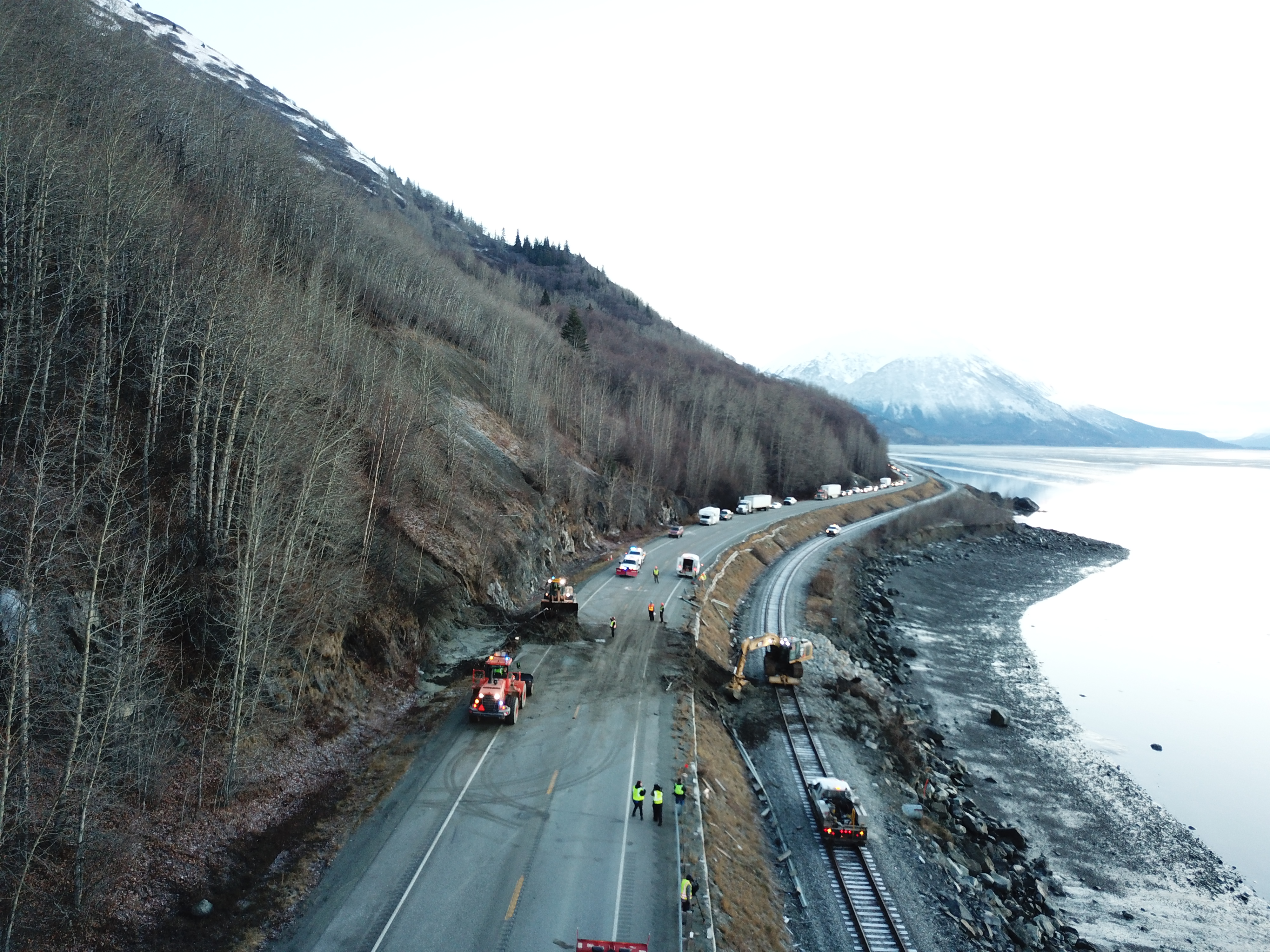 Alaska Department of Transportation crews work to clear a landslide that covered a portion of Seward Highway, near mile marker 105. (Photo courtesy Alaska Department of Transportation)