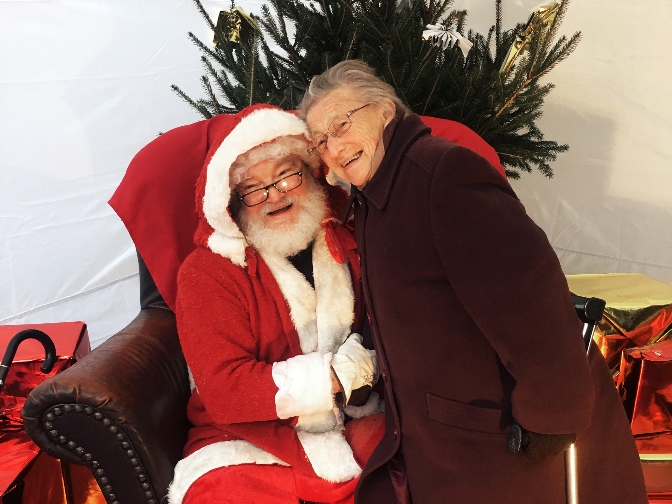 Haley and Andree Boursier, 88, pose for photos. She says she still believes in Pere Noel. (Photo by Eleanor Beardsley/NPR)