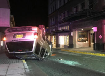 A 1999 gold Infinity SUV crashed Thursday night near Second and Seward streets in downtown Juneau. The driver and a passenger were taken to Bartlett Regional Hospital for treatment of their injuries. (Photo courtesy Justin Byrd)