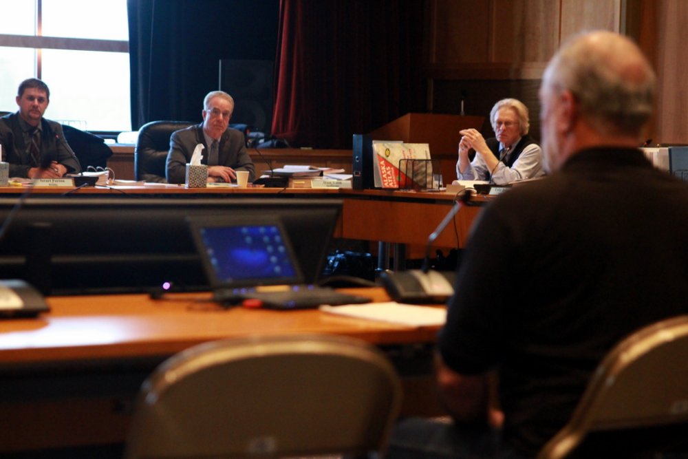 Board of Fisheries members Israel Payton (Wasilla), Alan Cain (Anchorage), and Fritz Johnson (Dillingham) hear testimony on shellfish proposals on the first day of the Southeast Shellfish/Finfish meeting in Sitka. (Photo by Robert Woolsey/KCAW)