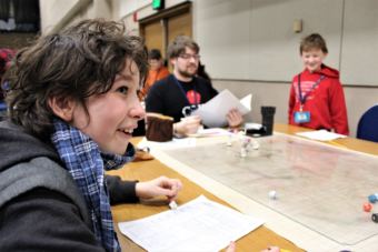 Keegan Ariail reacts to a move during a game of Dungeons & Dragons at Platypus Con on Jan. 28, 2018. (Photo by Adelyn Baxter/KTOO)