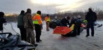 Bethel Search and Rescue releases Mark Kasayulie’s body to the Alaska State Troopers on Jan. 1, 2018, near Bethel's Hangar Lake. (Photo courtesy Perry Barr/Bethel Search and Rescue)