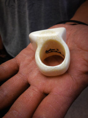 An Ivory ring carved and signed by King Island carver John I. Kokuluk. (Photo by Emily Russell/KNOM)