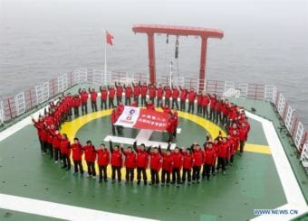 Scientists pose for team photo on the Chinese icebreaker Xuelong in 2017. (Photo by Xinhua/Yu Qiongyuan)