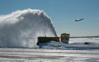 While mPing helps forecasters understand what’s happening in the air, it’s being used to study how surface transportation can be optimized during inclement weather. This is a snowblower at Boston Logan Airport. (Public domain photo by MassDOT)