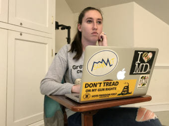Jordan Riger, 22, uses her laptop to track attendance for a weekly meeting of Students for the Second Amendment at the University of Delaware in Newark, Del. She sees firearms as tools for self-defense. (Photo by Hansi Lo Wang/NPR)