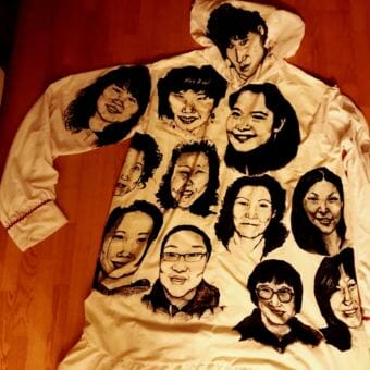 The kuspuk, made from recycled cotton sheets, is seven feet tall. The portraits are drawn in permanent marker. (Photo courtesy Amber Webb)