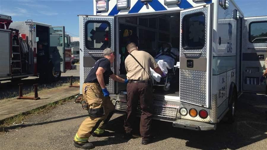 A woman is loaded into an ambulance in Huntington, West Virginia, following an opioid overdose rescue. Experts say a decline in overdose deaths in 14 states is due in part to increased use of the overdose antidote naloxone. (Photo by Pew Charitable Trusts)