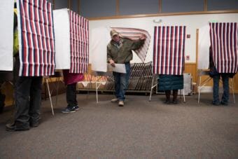 Bill Ferguson exits a voting booth at the Yupiit Piciryarait Cultural Center, one of two available precincts in Bethel, Alaska on November 8, 2016. (Photo by Katie Basile/KYUK)