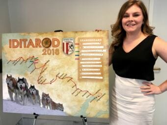 Devin O’Brien of Ketchikan poses with the Iditarod map outside of U.S. Sen. Lisa Murkowski's office in Washington, D.C., on March 12, 2018. O'Brien is one several staffers who updates the board.