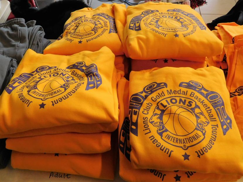 Gold Medal sweatshirts are among tournament gear sold to offset costs and support scholarships and other programs in Southeast Alaska. (Photo by Ed Schoenfeld, CoastAlaska News)