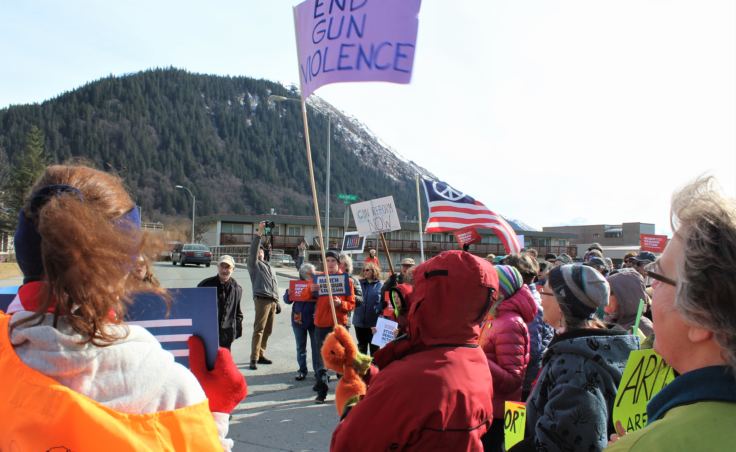 Protesters at Juneau's March for Our Lives gather outside the downtown offices of Sens. Lisa Murkowski and Dan Sullivan on March 24, 2018.